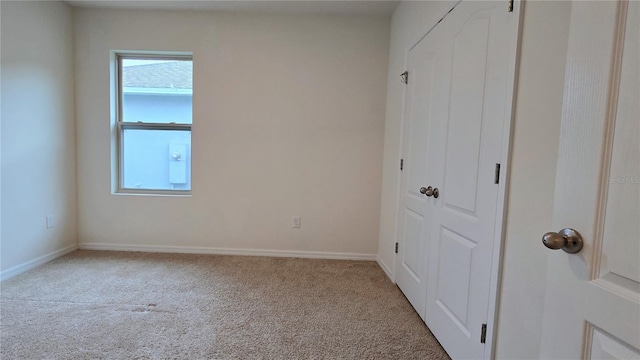 3202 Timber Hawk Cir, Ocoee, FL 34761 - unfurnished bedroom featuring multiple windows, carpet flooring, and a closet