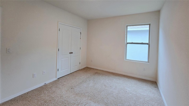 3202 Timber Hawk Cir, Ocoee, FL 34761 - unfurnished bedroom featuring carpet floors, multiple windows, and a closet