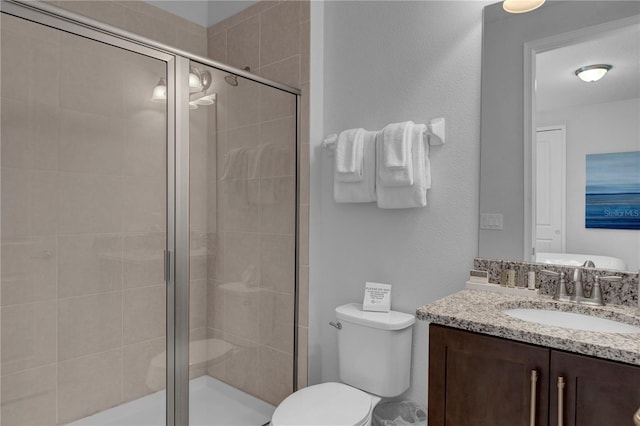 7524 Marker Ave, Kissimmee, FL 34747 - bathroom with vanity, toilet, and a stall shower