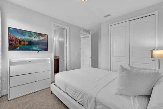 7524 Marker Ave, Kissimmee, FL 34747 - carpeted bedroom with a closet, baseboards, and connected bathroom