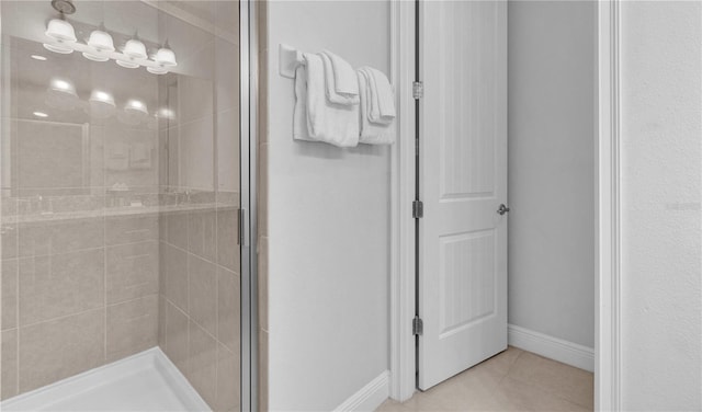 7524 Marker Ave, Kissimmee, FL 34747 - full bathroom with a shower stall, tile patterned flooring, and baseboards