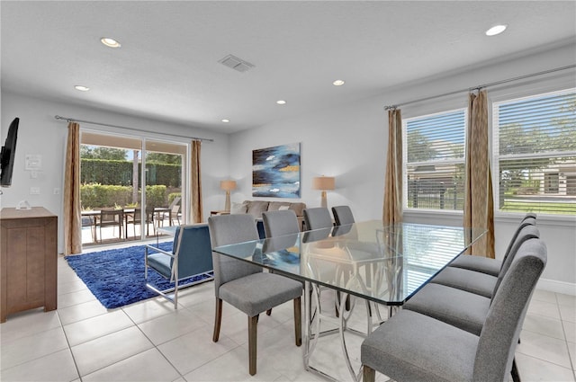 7524 Marker Ave, Kissimmee, FL 34747 - dining area with recessed lighting and light tile patterned floors