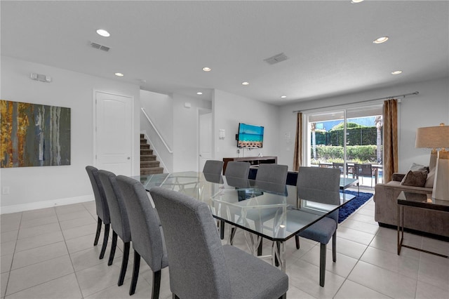 7524 Marker Ave, Kissimmee, FL 34747 - dining space featuring recessed lighting, stairs, light tile patterned floors, and baseboards