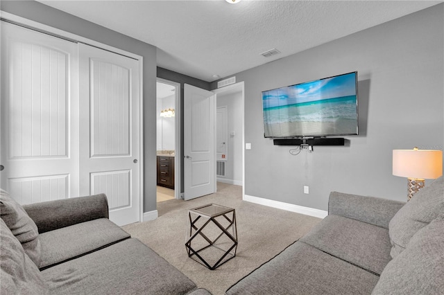 7524 Marker Ave, Kissimmee, FL 34747 - living area with baseboards, carpet flooring, and a textured ceiling