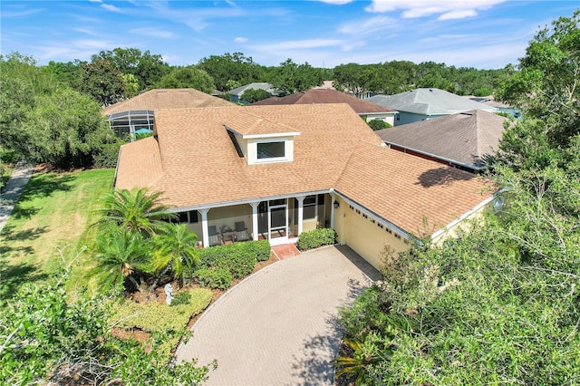 217 Lake Cassidy Dr, Kissimmee, FL 34759 - view of front facade with an attached garage, a shingled roof, and driveway