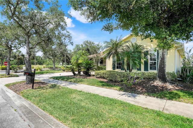 217 Lake Cassidy Dr, Kissimmee, FL 34759 - view of side of home with stucco siding