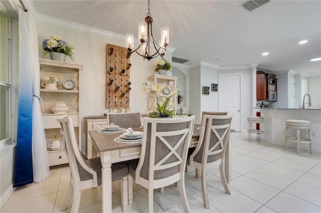 217 Lake Cassidy Dr, Kissimmee, FL 34759 - dining area with a chandelier, ornamental molding, light tile patterned floors, and recessed lighting