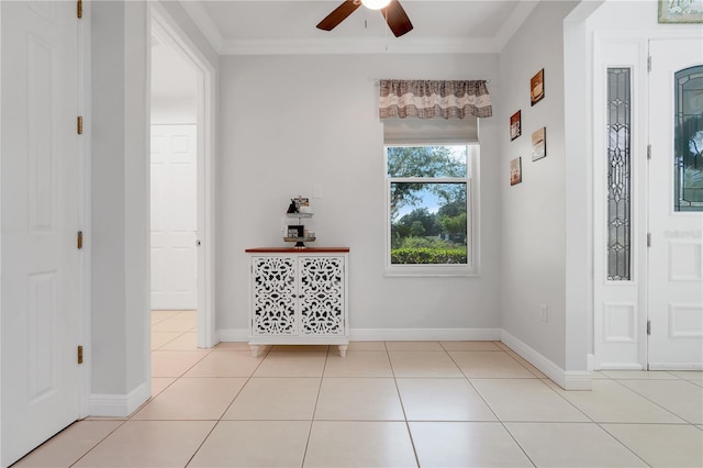 217 Lake Cassidy Dr, Kissimmee, FL 34759 - entryway featuring a ceiling fan, crown molding, light tile patterned flooring, and baseboards