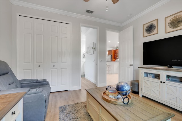 217 Lake Cassidy Dr, Kissimmee, FL 34759 - living room with light wood finished floors, ornamental molding, a ceiling fan, and baseboards