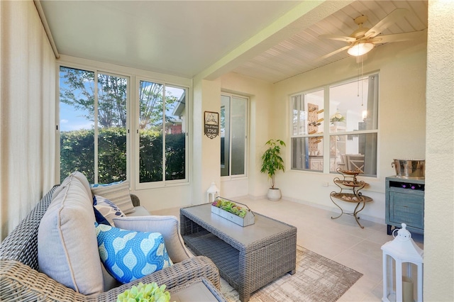 217 Lake Cassidy Dr, Kissimmee, FL 34759 - sunroom featuring beam ceiling, ceiling fan, and an outdoor living space