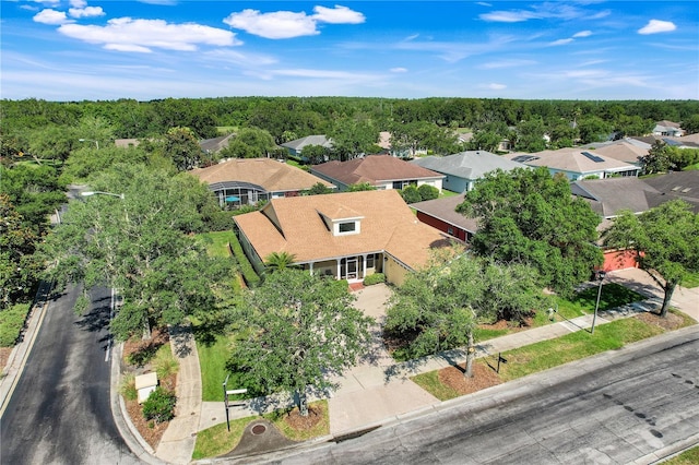 217 Lake Cassidy Dr, Kissimmee, FL 34759 - aerial perspective of suburban area featuring a heavily wooded area