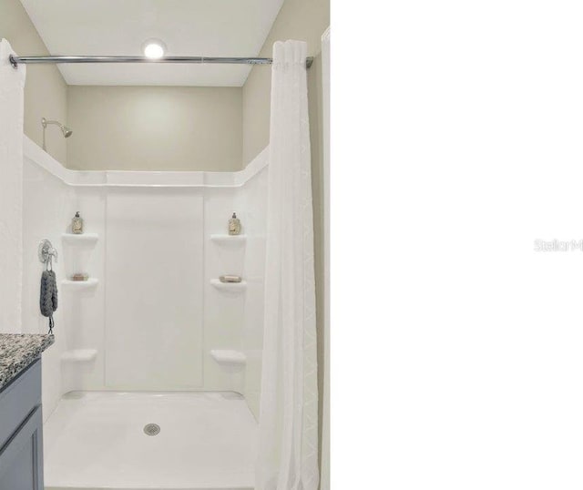 4932 Kaia Ave, Winter Haven, FL 33884 - bathroom with vanity and a shower with shower curtain
