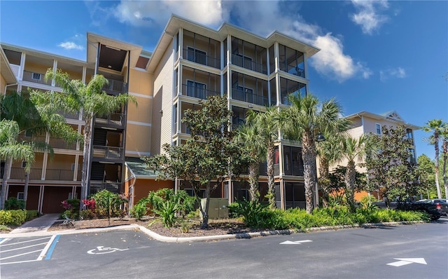 9051 Treasure Trove Ln Unit 505, Kissimmee, FL 34747 - view of apartment building / complex featuring uncovered parking