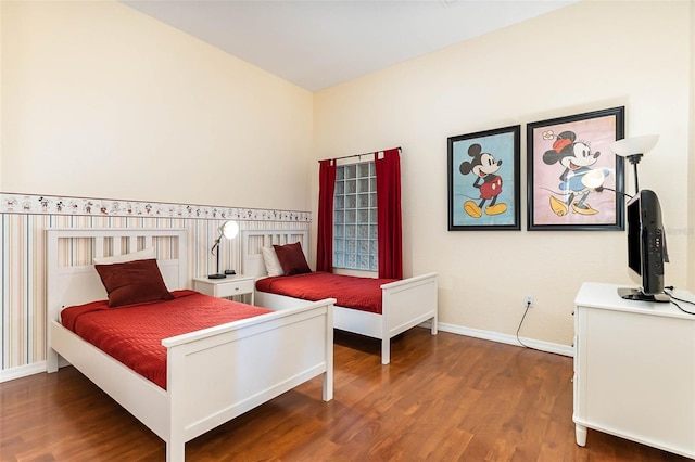 9051 Treasure Trove Ln Unit 505, Kissimmee, FL 34747 - bedroom featuring wood finished floors and baseboards