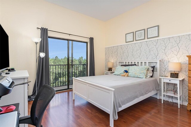 9051 Treasure Trove Ln Unit 505, Kissimmee, FL 34747 - bedroom with access to outside, wood finished floors, and a desk