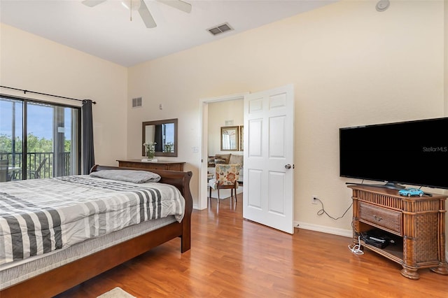 9051 Treasure Trove Ln Unit 505, Kissimmee, FL 34747 - bedroom featuring wood finished floors, access to exterior, baseboards, and ceiling fan