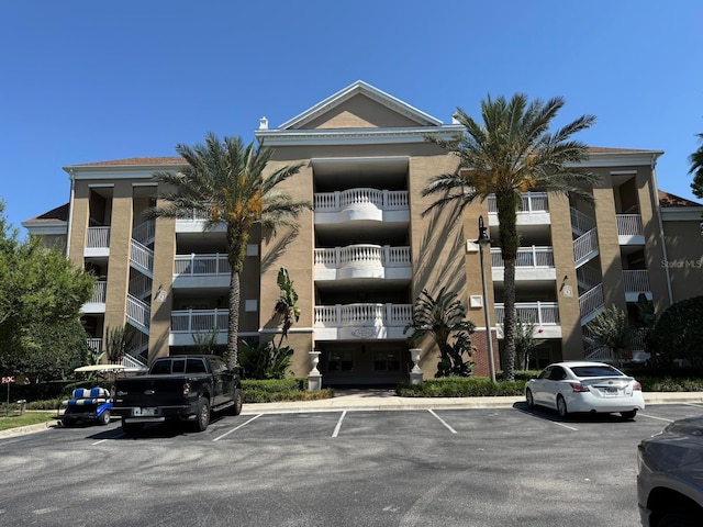 7651 Whisper Way Unit 201, Kissimmee, FL 34747 - view of apartment building / complex featuring uncovered parking