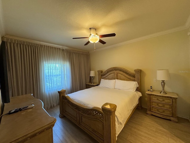 7651 Whisper Way Unit 201, Kissimmee, FL 34747 - bedroom with light wood-style floors, crown molding, ceiling fan, and a textured ceiling