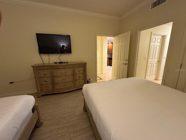 7651 Whisper Way Unit 201, Kissimmee, FL 34747 - bedroom featuring crown molding and baseboards