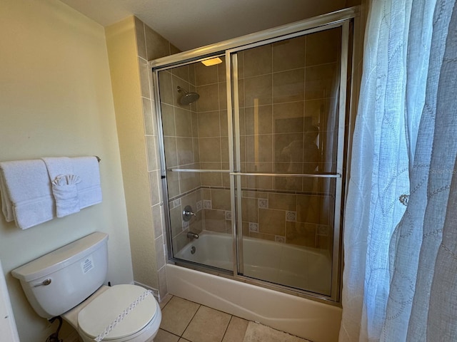 7651 Whisper Way Unit 201, Kissimmee, FL 34747 - bathroom featuring toilet, shower / bath combination with glass door, and tile patterned floors