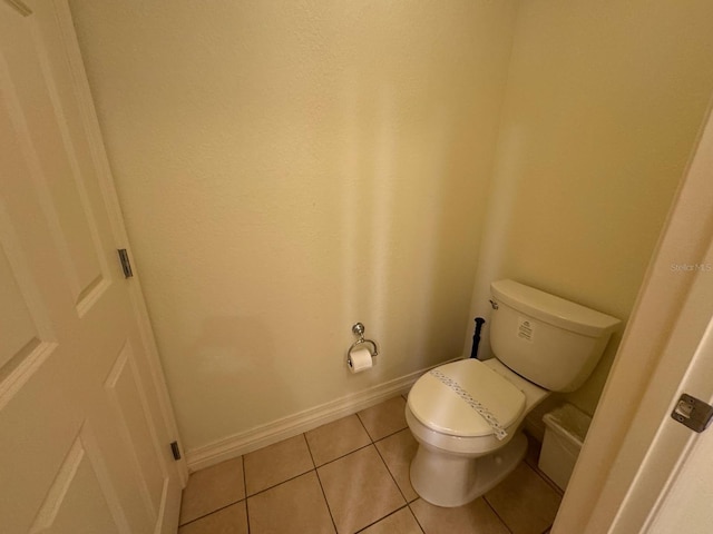 7651 Whisper Way Unit 201, Kissimmee, FL 34747 - bathroom with baseboards, tile patterned flooring, and toilet