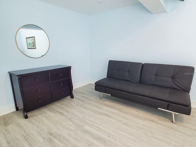 215 Medallion Blvd Unit G, Madeira Beach, FL 33708 - sitting room with wood finished floors and baseboards
