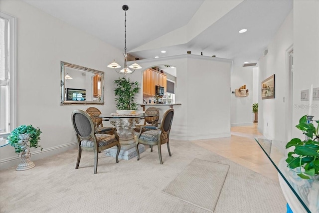 206 Islandia Ct Unit U206, Satellite Beach, FL 32937 - dining area with vaulted ceiling, a chandelier, recessed lighting, baseboards, and light tile patterned floors