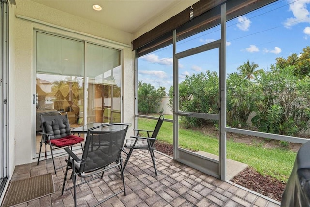 206 Islandia Ct Unit U206, Satellite Beach, FL 32937 - sunroom featuring outdoor dining space