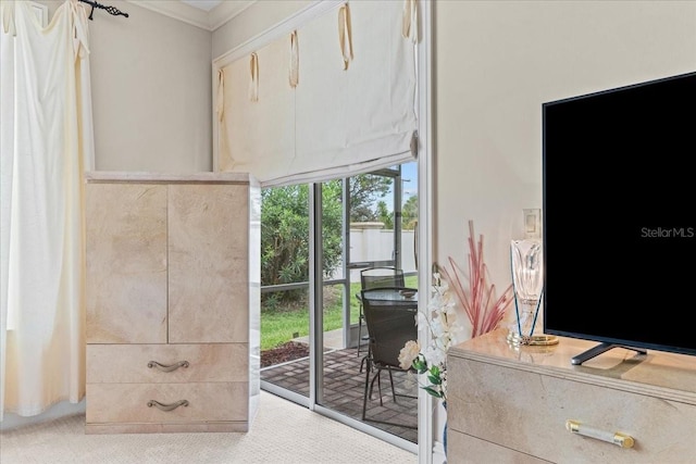 206 Islandia Ct Unit U206, Satellite Beach, FL 32937 - doorway to outside featuring carpet floors and ornamental molding