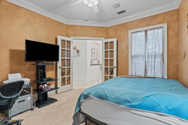 206 Islandia Ct Unit U206, Satellite Beach, FL 32937 - bedroom featuring french doors, carpet floors, ornamental molding, and ceiling fan