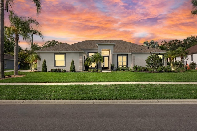 1301 Johns Cove Ln, Oakland, FL 34787 - view of front of house with stucco siding and a lawn