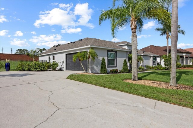 1301 Johns Cove Ln, Oakland, FL 34787 - single story home featuring stucco siding, a garage, and driveway