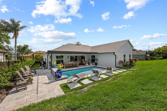 1301 Johns Cove Ln, Oakland, FL 34787 - back of house with a patio area, stucco siding, and a shingled roof