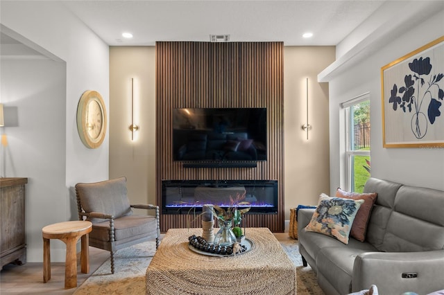 1301 Johns Cove Ln, Oakland, FL 34787 - living room featuring a glass covered fireplace and recessed lighting