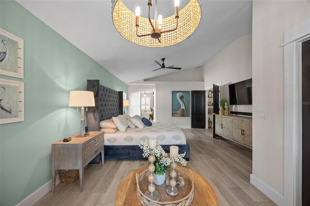 1301 Johns Cove Ln, Oakland, FL 34787 - bedroom featuring wood finished floors, lofted ceiling, baseboards, and a chandelier