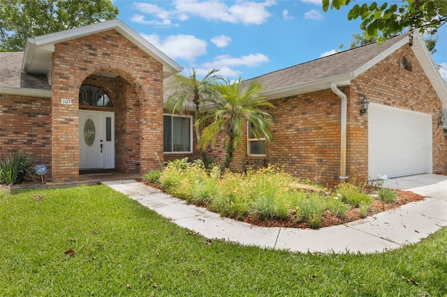 109 Hunter Point Ct, Debary, FL 32713 - view of front of property featuring brick siding, roof with shingles, a front yard, and an attached garage