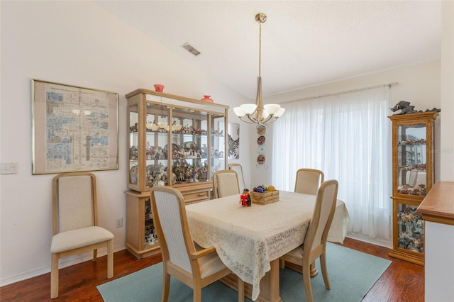 109 Hunter Point Ct, Debary, FL 32713 - dining area featuring a chandelier, wood finished floors, and lofted ceiling