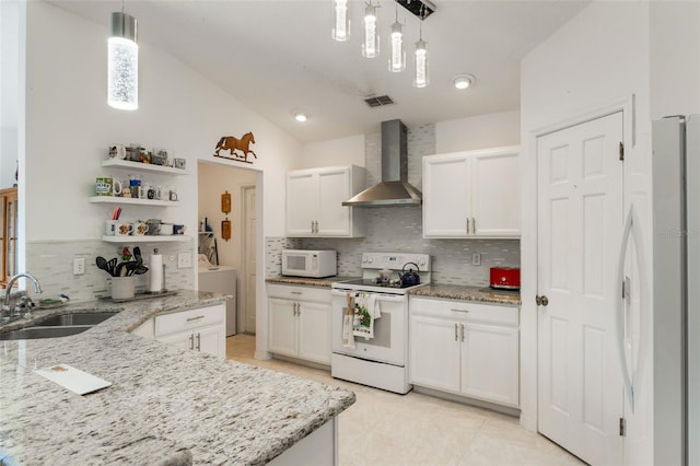 109 Hunter Point Ct, Debary, FL 32713 - kitchen with wall chimney exhaust hood, white appliances, a sink, washer / dryer, and backsplash