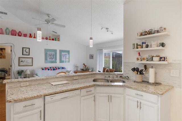 109 Hunter Point Ct, Debary, FL 32713 - kitchen with dishwasher, a sink, lofted ceiling, ceiling fan, and light stone countertops