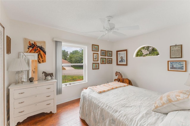 109 Hunter Point Ct, Debary, FL 32713 - bedroom featuring wood finished floors, baseboards, and a ceiling fan