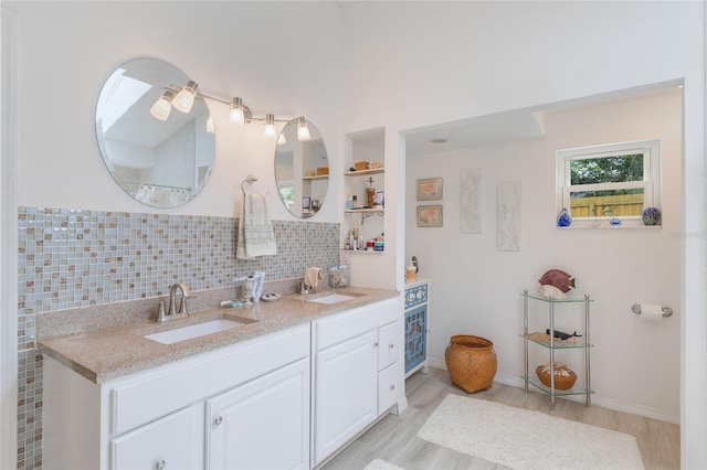 109 Hunter Point Ct, Debary, FL 32713 - full bath with wood finished floors, double vanity, and decorative backsplash
