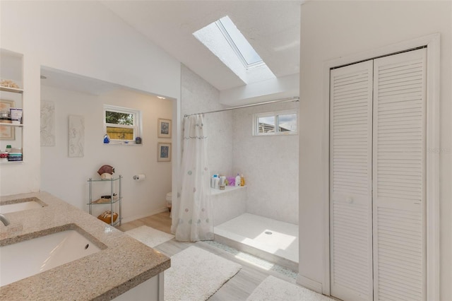 109 Hunter Point Ct, Debary, FL 32713 - full bath with a closet, lofted ceiling, a skylight, toilet, and wood finished floors