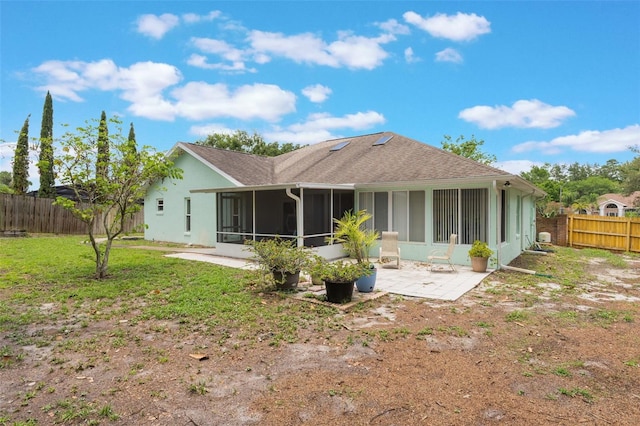 109 Hunter Point Ct, Debary, FL 32713 - rear view of house featuring a sunroom, stucco siding, a patio, and a shingled roof