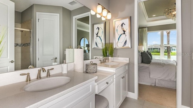 3142 Torta Ct, Bradenton, FL 34211 - bathroom with connected bathroom, crown molding, double vanity, tiled shower, and tile patterned floors