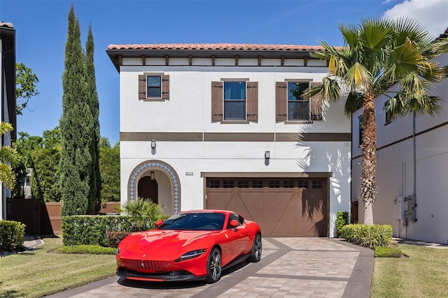 8113 Via Vittoria Way, Orlando, FL 32819 - mediterranean / spanish-style house featuring stucco siding, decorative driveway, and a garage