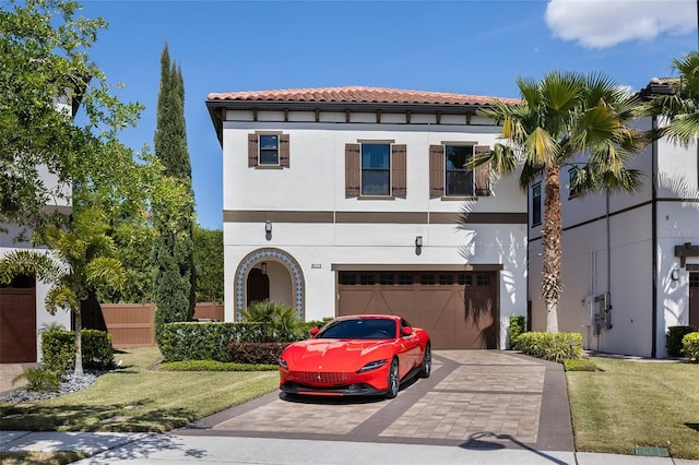 8113 Via Vittoria Way, Orlando, FL 32819 - mediterranean / spanish-style home featuring driveway, stucco siding, a garage, a front yard, and a tile roof