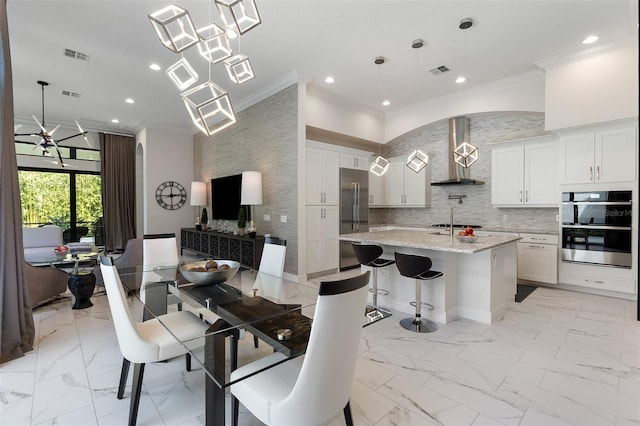 8113 Via Vittoria Way, Orlando, FL 32819 - dining room with crown molding, light marble finish floors, and recessed lighting
