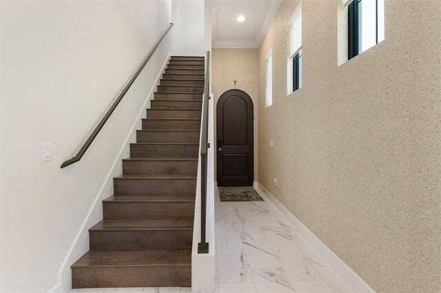 8113 Via Vittoria Way, Orlando, FL 32819 - stairway featuring marble finish floors, baseboards, ornamental molding, and recessed lighting