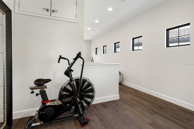 8113 Via Vittoria Way, Orlando, FL 32819 - exercise room with recessed lighting, baseboards, and wood finished floors