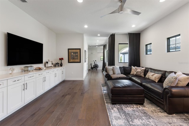 8113 Via Vittoria Way, Orlando, FL 32819 - living room featuring recessed lighting, ceiling fan, dark wood-type flooring, and baseboards